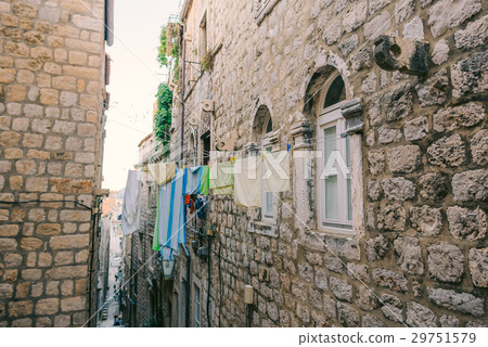 Clothes dries on ropes on clothespins Clothes dries on ropes on clothespins 29751579