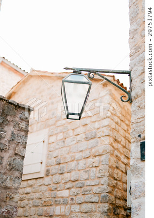 Vintage lamp on wall on street 29751794