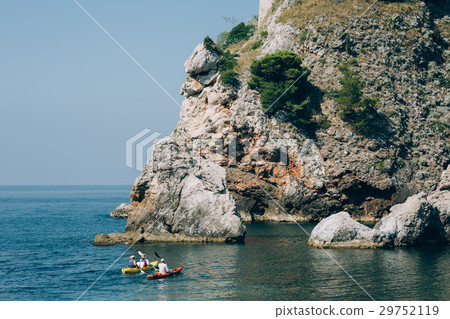 Kayaks at sea. Tourist kayaking in the sea near 29752119
