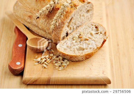 Freshly baked traditional bread on wooden board 29756506