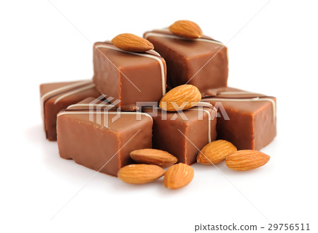 Chocolate praline with almonds on white background Chocolate praline with almonds on white background 29756511