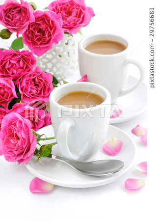 Cups of coffee and pink roses on white background Cups of coffee and pink roses on white background 29756681
