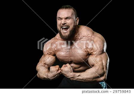 Handsome athletic man training pumping up muscles Handsome athletic man training pumping up muscles 29759843