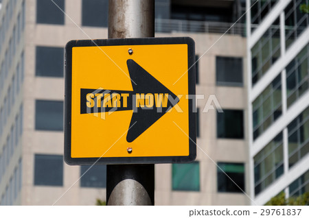 Directional sign with conceptual message START NOW 29761837