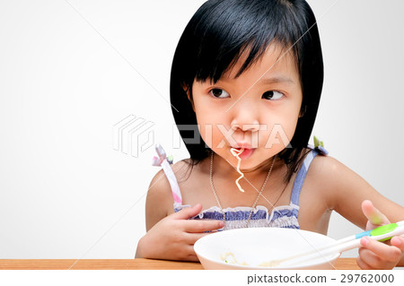 Asian child girl eating Instant noodles Asian child girl eating Instant noodles 29762000