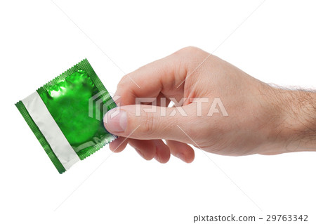 Condom in female hand isolated Condom in female hand isolated 29763342