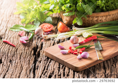 chilli and onion on wood block with vegetables chilli and onion on wood block with vegetables 29763692