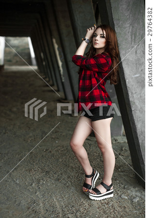 Beautiful young hipster girl posing and smiling  29764382