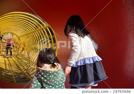Sisters playing in the park 29765686