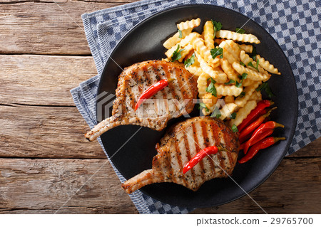 spicy pork chop with chili and french fries 29765700