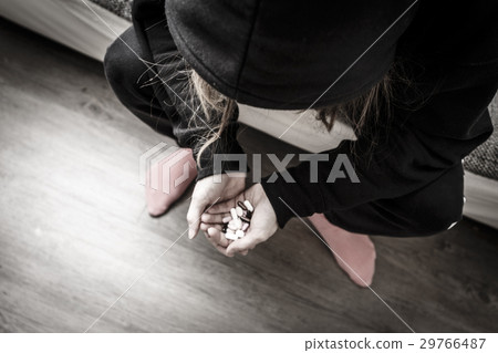 young woman with headache and pills 29766487
