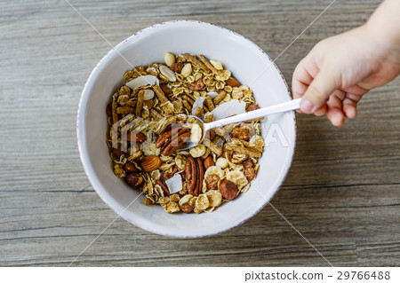 bowl with muesli and spoon on the wooden bowl with muesli and spoon on the wooden 29766488
