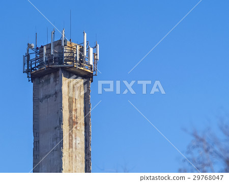 Huge factory pipe on blue sky background close-up 29768047