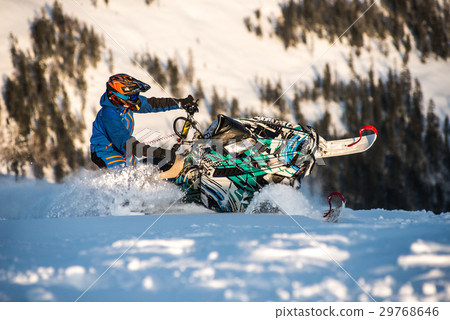 Rider on the snowmobile in the mountains. active Rider on the snowmobile in the mountains. active 29768646