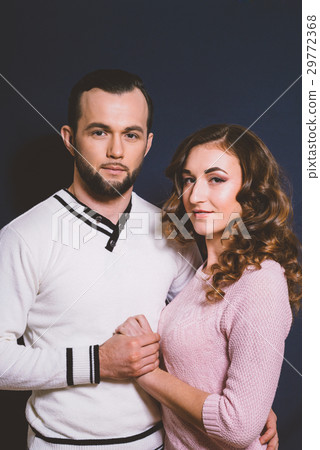 Couple in love in studio on a dark background 29772368