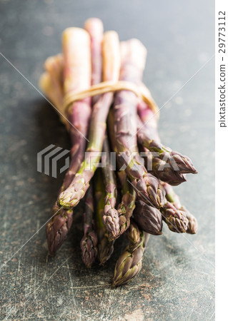 Fresh purple asparagus. 29773112