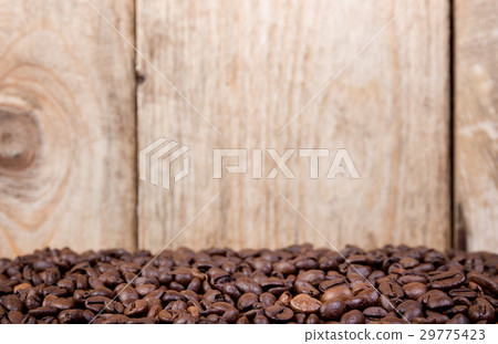 Coffee beans on wood background 29775423