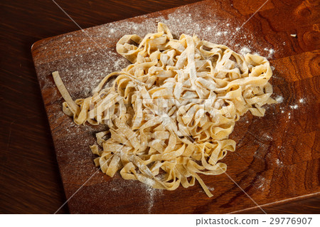 Fresh pasta on board  29776907