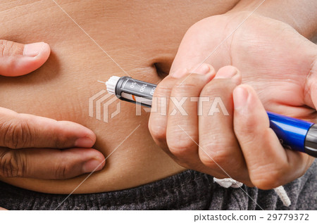 Making injection with insulin pen or syringe. 29779372