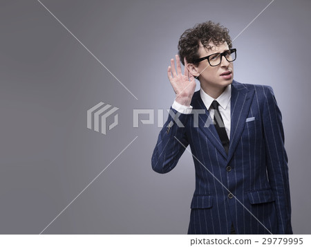 Man cupping hand behind ear Man cupping hand behind ear 29779995