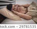 Young Asian Caucasian man on bed 29781535