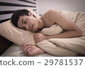 Young Asian Caucasian man on bed 29781537