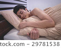 Young Asian man smiling while sleeping 29781538