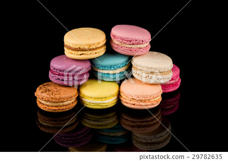 Colorful macaroon over black background 29782635