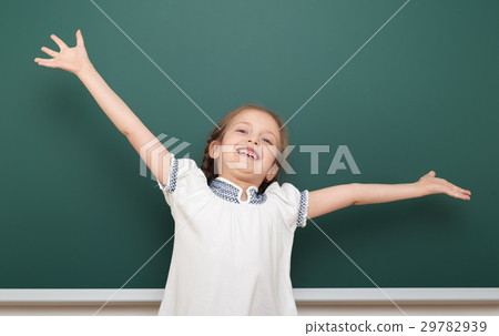 school student girl posing at clean blackboard 29782939