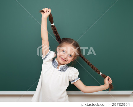 school student girl posing at clean blackboard school student girl posing at clean blackboard 29782964
