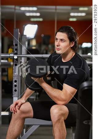 Muscle male in the black sportwear working with Muscle male in the black sportwear working with 29783919