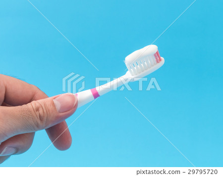 Closeup man hand holding toothbrush Closeup man hand holding toothbrush 29795720