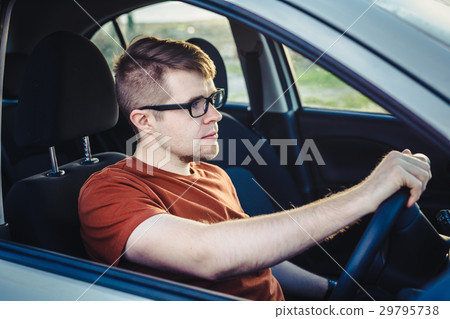 Man driving his car Man driving his car 29795738