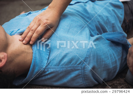 Emergency CPR on an Adult in Lifesaving Training 29796424