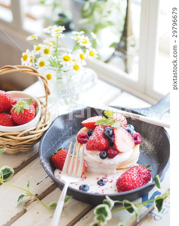 Plenty of strawberry pancakes with skillet 29796679