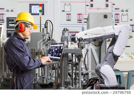 Engineer using laptop computer for maintenance automatic robotic Engineer using laptop computer for maintenance automatic robotic 29796798