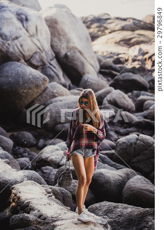 Stylish hipster woman in checkered shirt and 29796849