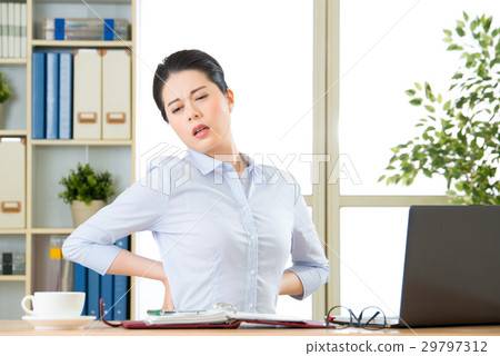 Young asian businesswoman with pain in back 29797312