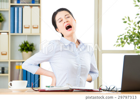 Young asian businesswoman with pain in back 29797313
