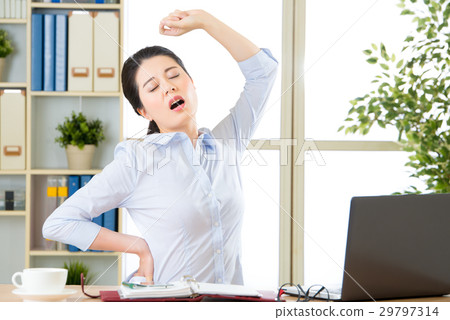 Asian businesswoman fell tired and stretching 29797314