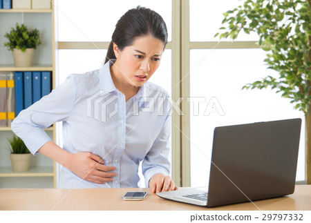 Young asian business woman with stomachache Young asian business woman with stomachache 29797332