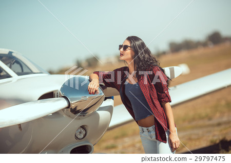 Woman pilot and private business airplane Woman pilot and private business airplane 29797475