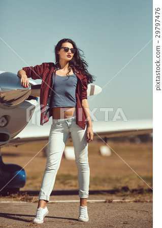 Woman pilot and private business airplane Woman pilot and private business airplane 29797476