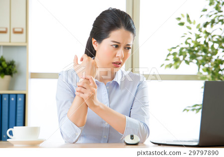 Young asian business woman with pain in wrist 29797890