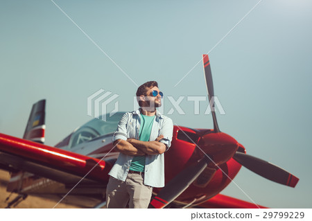Man in front of vintage plane Man in front of vintage plane 29799229