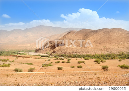 Lonely road near mountains in desert of Morocco Lonely road near mountains in desert of Morocco 29800035