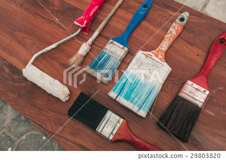 Paint brushes on the old wooden background Paint brushes on the old wooden background 29803820