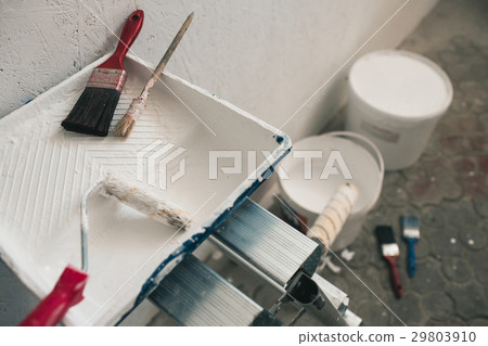 Wall prepared for painting. Brushes, buckets of 29803910