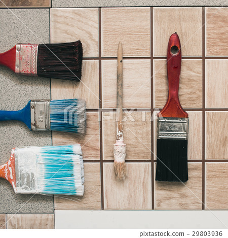 Paint brushes on the old tile background Paint brushes on the old tile background 29803936