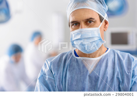 Male doctor glancing rather seriously 29804001